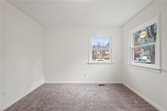 unfurnished room with carpet