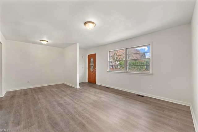 empty room with wood-type flooring