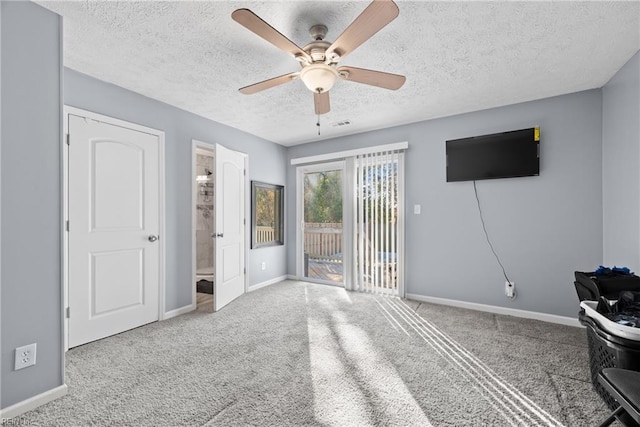 unfurnished bedroom with ceiling fan, carpet, access to outside, and a textured ceiling