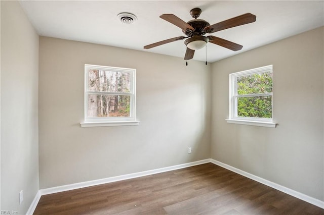 unfurnished room with ceiling fan and hardwood / wood-style floors