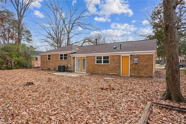 rear view of property featuring central AC and a patio