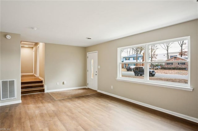 unfurnished living room with light wood-type flooring