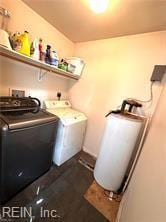 laundry area with washing machine and dryer