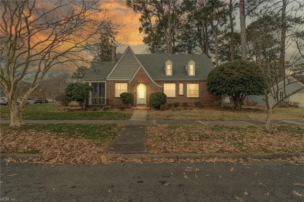 view of front of property with a yard