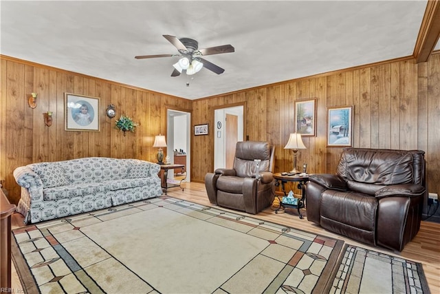 living room with ceiling fan and light tile patterned flooring