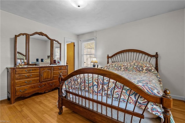 bedroom with light hardwood / wood-style floors