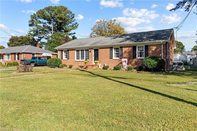 ranch-style house featuring a front lawn