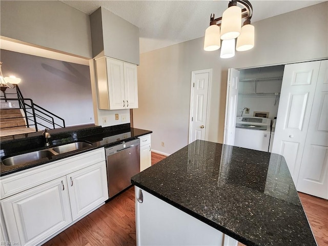 kitchen featuring dishwasher, pendant lighting, washer / clothes dryer, sink, and white cabinetry