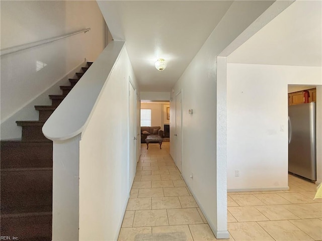 corridor with light tile patterned floors