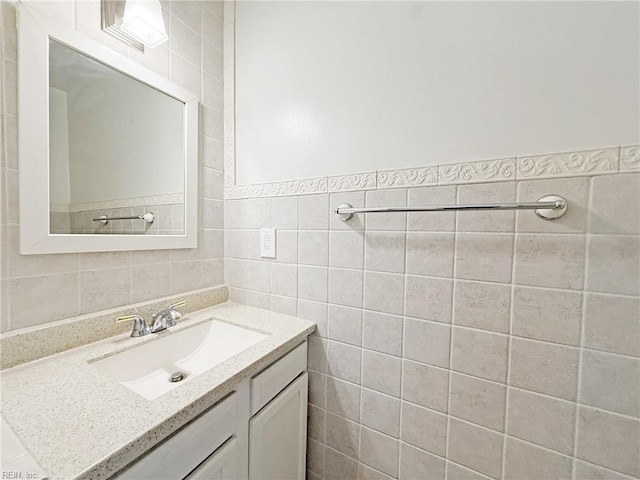 bathroom with tile walls and vanity