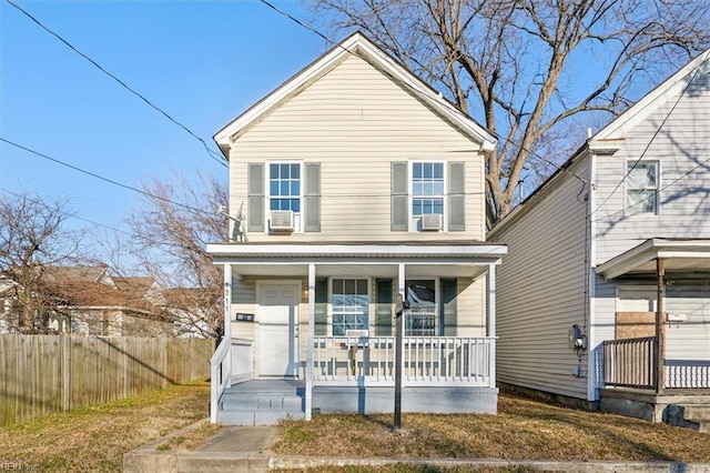 view of property featuring a front yard and a porch