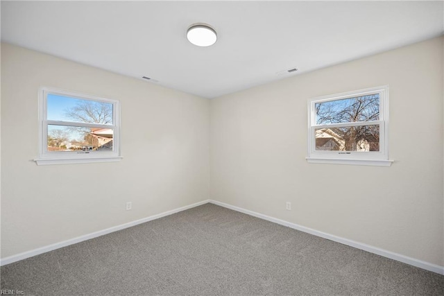 unfurnished room with carpet flooring