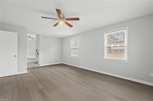 empty room with hardwood / wood-style floors