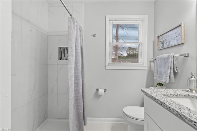 bathroom featuring curtained shower, toilet, and vanity