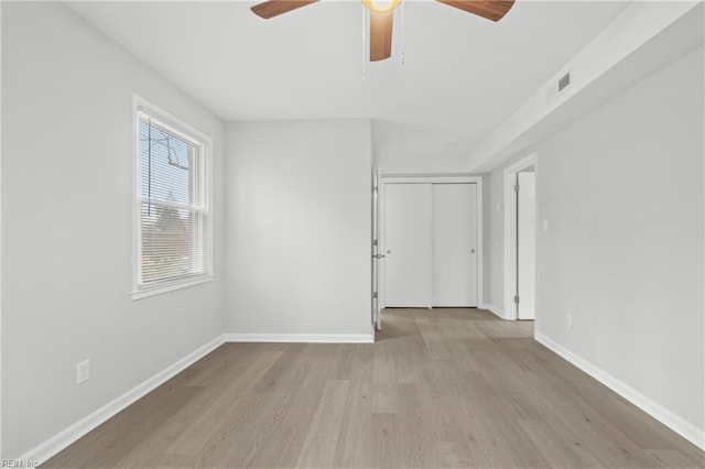 spare room featuring ceiling fan and light hardwood / wood-style flooring