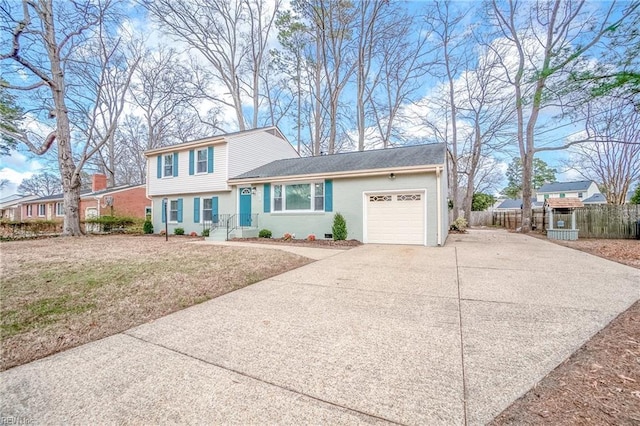 view of front of home with a front yard and a garage