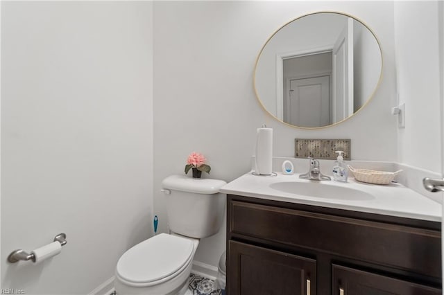 bathroom with toilet and vanity