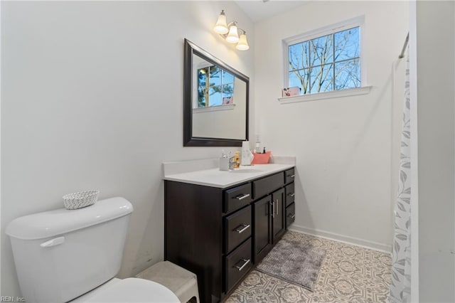 bathroom featuring toilet, vanity, and tile patterned floors