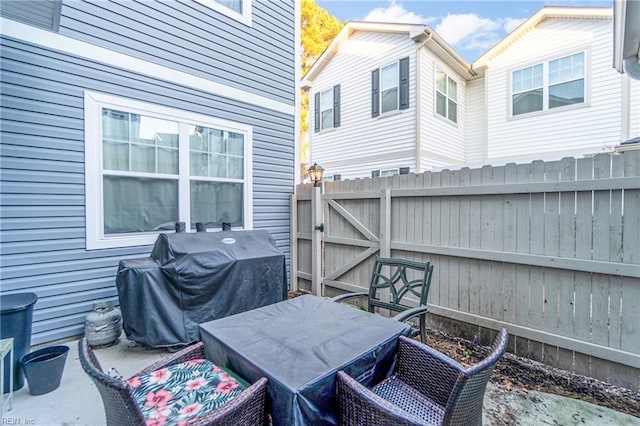 view of patio with a grill