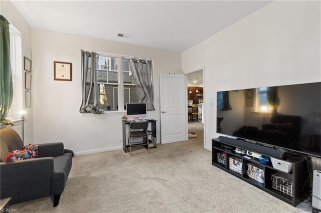 living room featuring light colored carpet