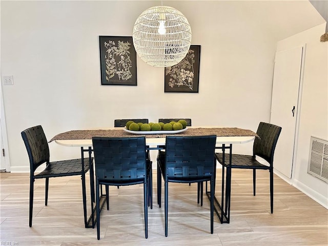 dining space with a notable chandelier