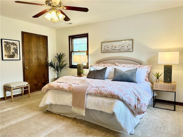 bedroom featuring ceiling fan and carpet