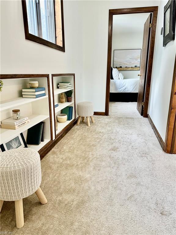 sitting room with light colored carpet