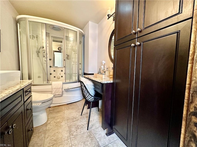 full bathroom with toilet, enclosed tub / shower combo, and vanity