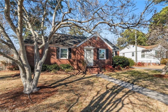 bungalow featuring a front yard