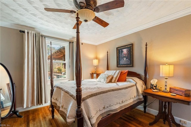 bedroom featuring ceiling fan, crown molding, and hardwood / wood-style flooring