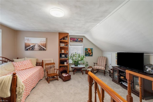 carpeted bedroom featuring vaulted ceiling