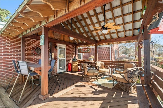 wooden deck featuring ceiling fan