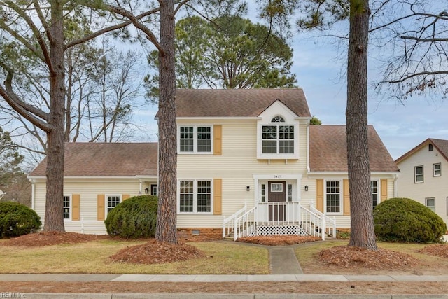 colonial-style house with a front yard