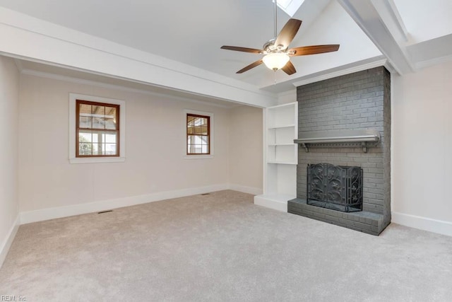 unfurnished living room with light carpet, a brick fireplace, crown molding, and ceiling fan