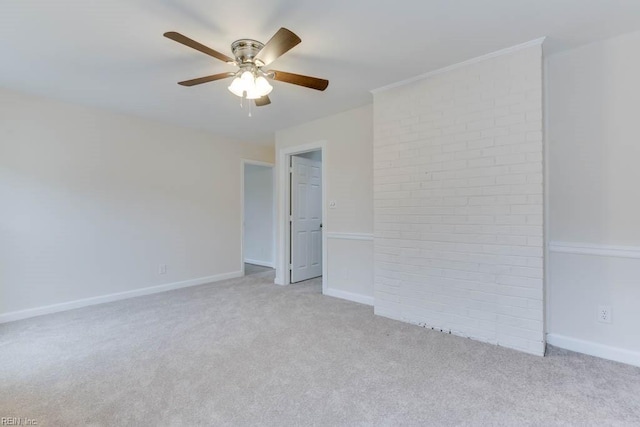 empty room with ceiling fan and light carpet