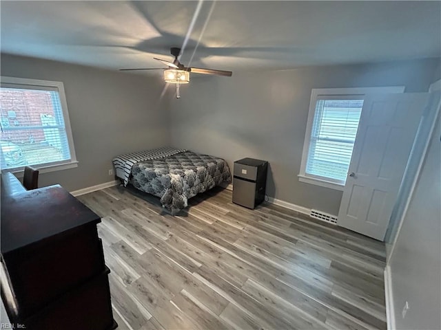 bedroom featuring ceiling fan and hardwood / wood-style floors