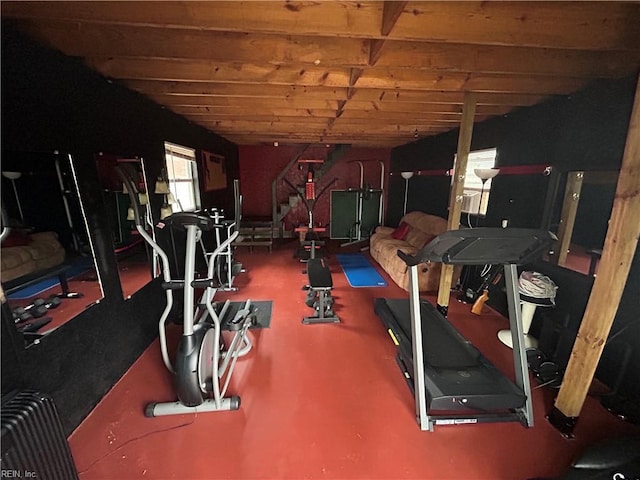 exercise room featuring vaulted ceiling