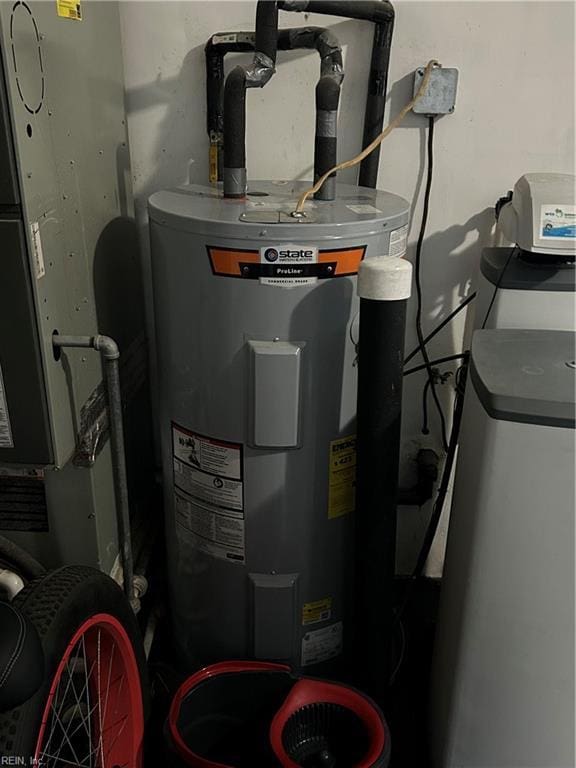 utility room featuring electric water heater