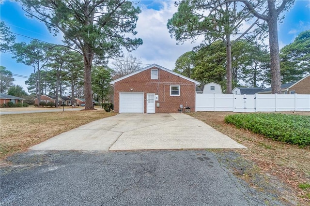 view of side of property featuring a garage, a lawn, and an outdoor structure