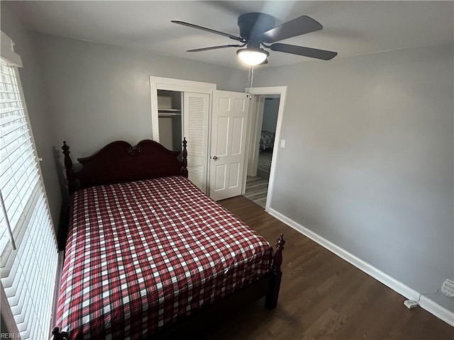 bedroom featuring ceiling fan, a closet, and dark hardwood / wood-style flooring