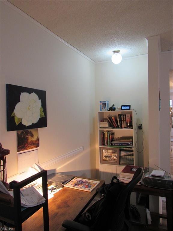 home office with a textured ceiling and ornamental molding