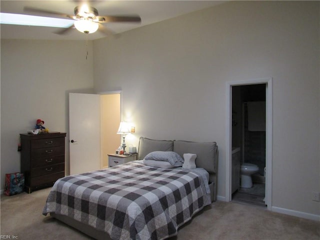 carpeted bedroom featuring ceiling fan and connected bathroom