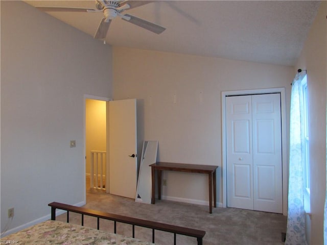 bedroom featuring vaulted ceiling, ceiling fan, carpet flooring, and a closet