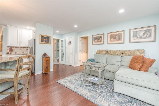 living room with dark hardwood / wood-style floors