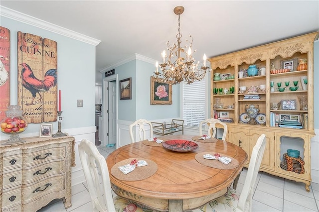 tiled dining space with an inviting chandelier and crown molding