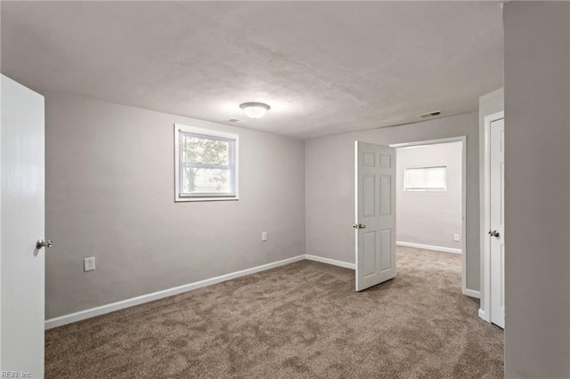 view of carpeted spare room