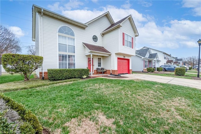 view of front of property with a garage and a front lawn