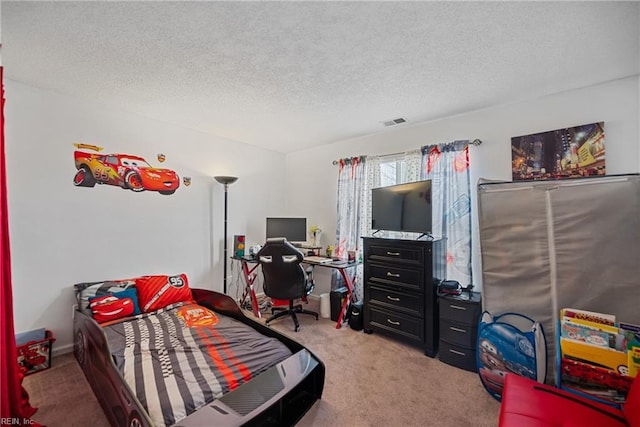 carpeted bedroom featuring a textured ceiling