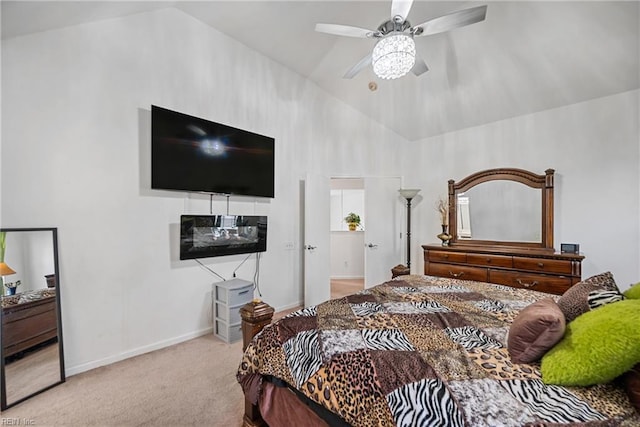 bedroom with ceiling fan, light carpet, and vaulted ceiling