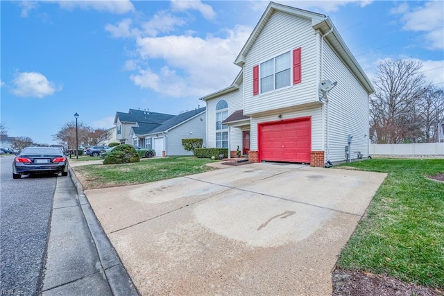 front facade featuring a front yard and a garage